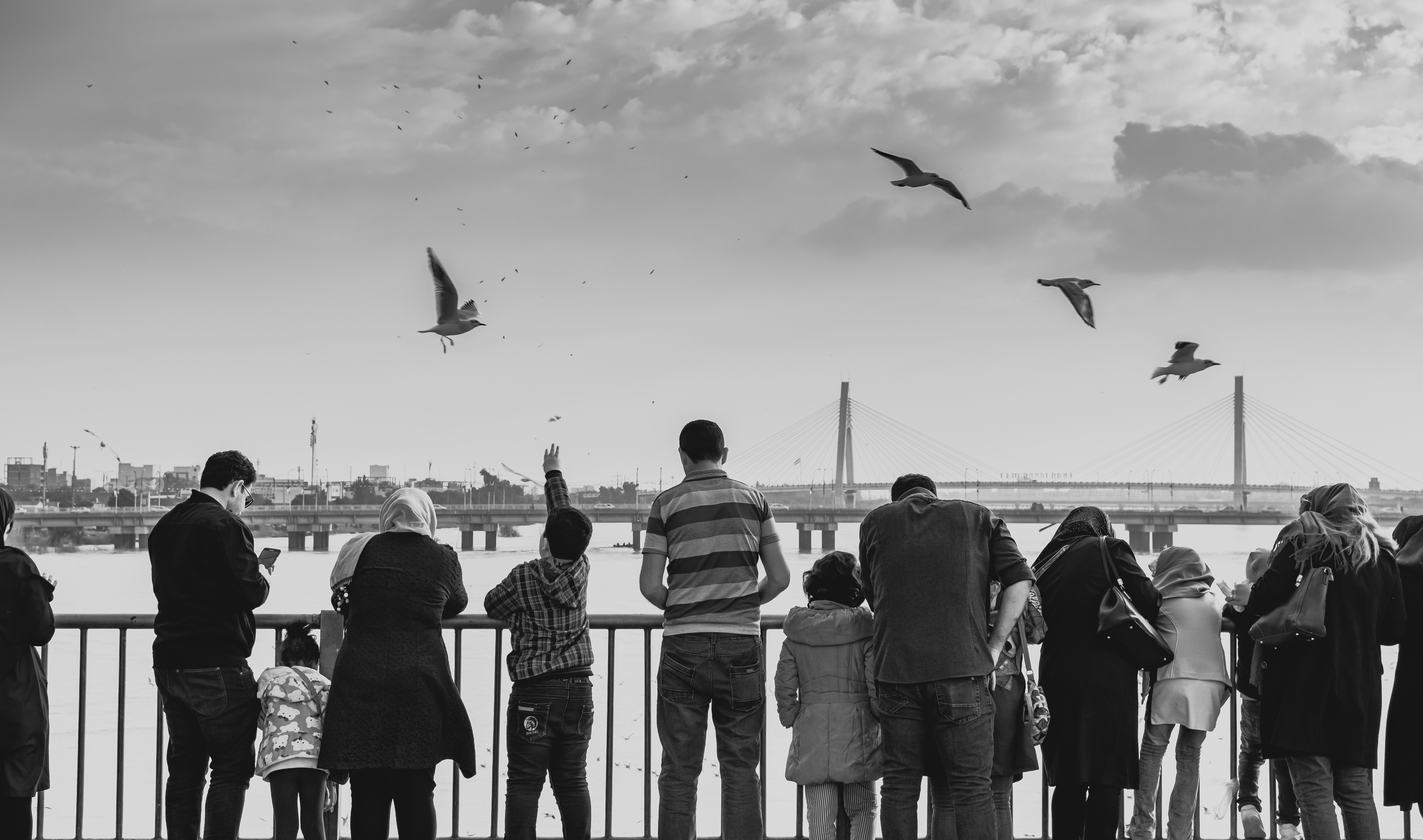 grayscale photography of people near outdoor during daytime